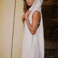 White hooded sleeveless romper with frayed hem and side slits