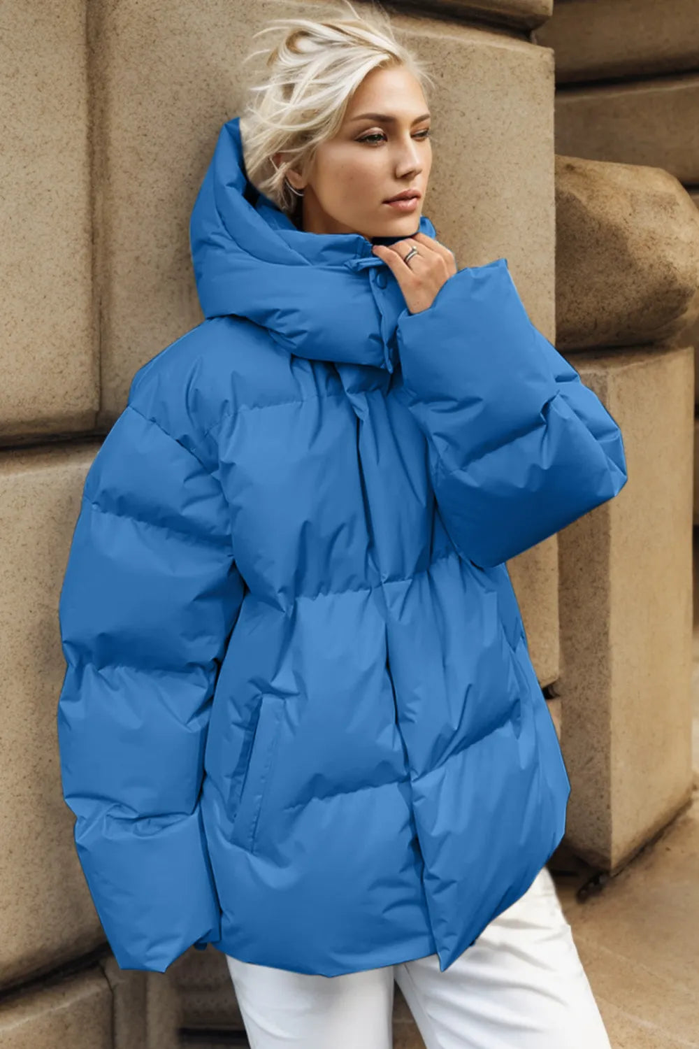 Blue pocketed zip-up hooded puffer jacket with oversized design