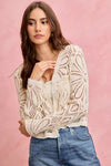 Cream-colored crochet knit long sleeve cardigan with floral lace patterns