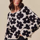SO ME loose fit gray knit sweater top with black floral patterns
