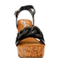 Black leather Emelda wedge sandal with cork platform and chain strap