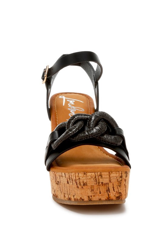 Black leather Emelda wedge sandal with cork platform and chain strap