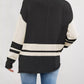 Black and cream color block side slit knit sweater with striped sleeves