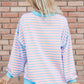 Pastel pink and light blue striped high-low sweatshirt with turquoise trim