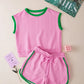 Pink cable-knit sleeveless top with green trim and matching shorts set