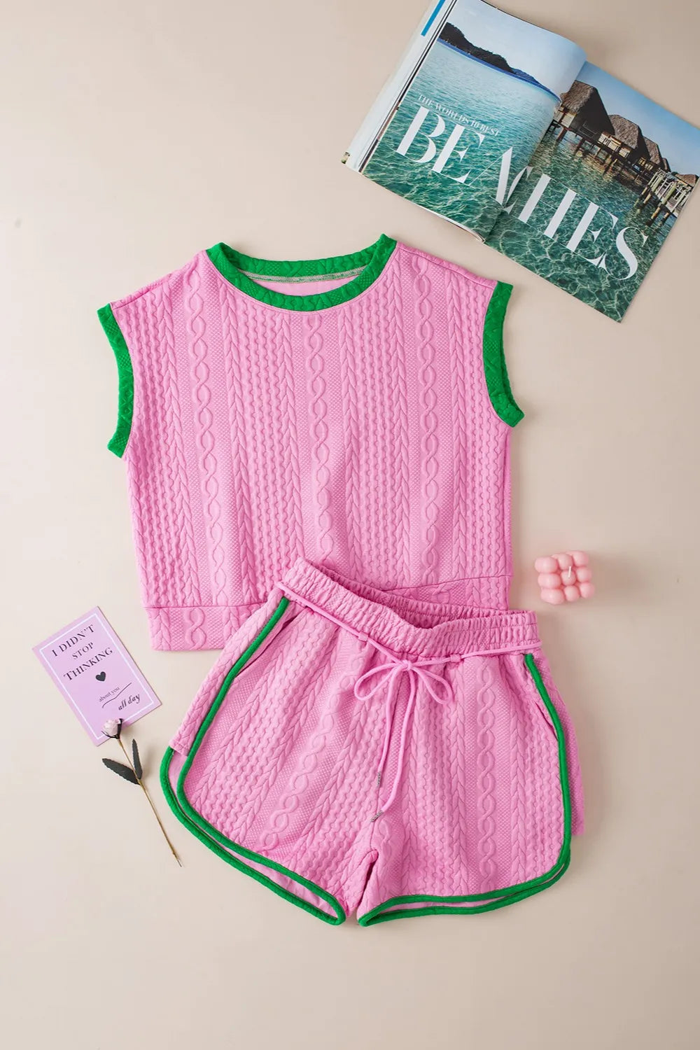 Pink cable-knit sleeveless top with green trim and matching shorts set