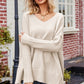 Beige v-neck dropped shoulder ribbed long sleeve knit sweater