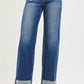High-waisted blue denim wide-leg jeans with rolled cuffs