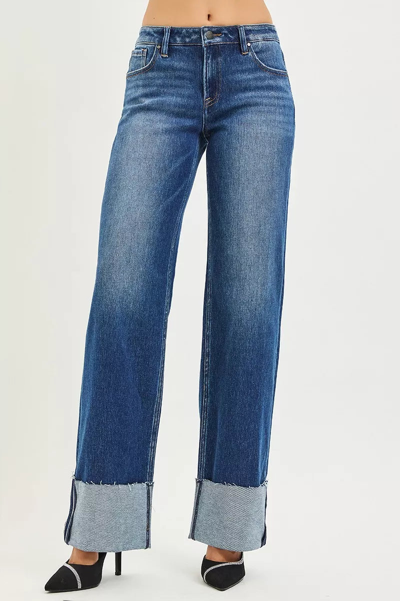 High-waisted blue denim wide-leg jeans with rolled cuffs