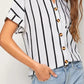 White and black striped short-sleeve button-up shirt with gold buttons