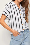 White and black striped short-sleeve button-up shirt with gold buttons