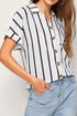 White and black striped short-sleeve button-up shirt with gold buttons