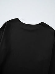 Black long-sleeved Daverri Fashions round neck top with ribbed cuffs