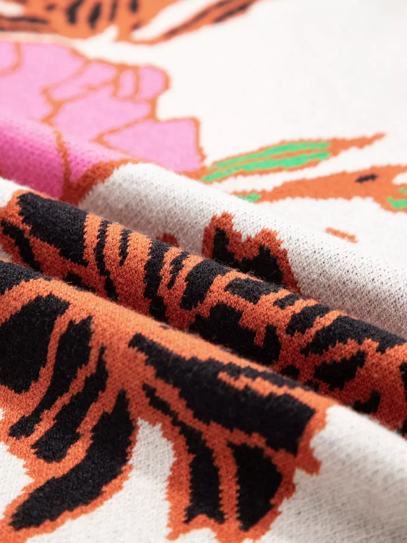 Tiger print socks with orange black stripes on white background