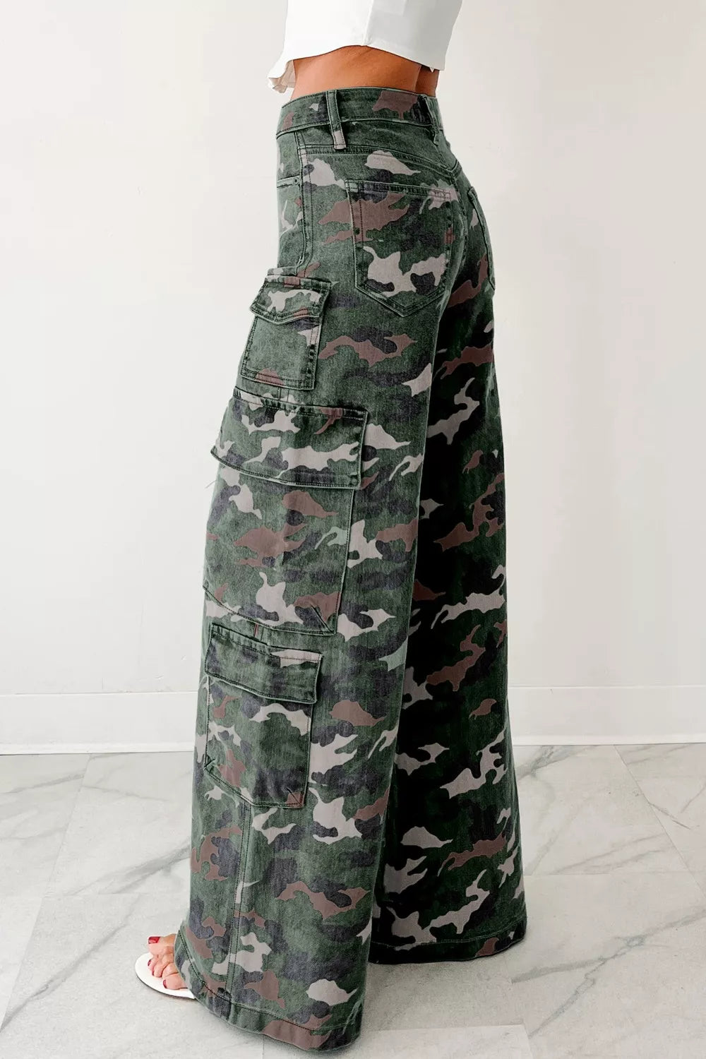 Camo print high-waisted wide-leg denim cargo pants in faded green, brown, gray pattern