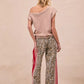 BiBi Leopard Print Pants with beige leopard print and red-white side stripes