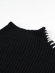 Black ribbed knit sweater with white contrast stitch mock neck