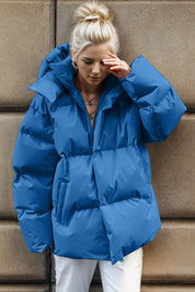Royal blue oversized hooded puffer jacket with pockets and zip-up