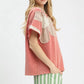Pink Umgee French Terry short-sleeved top with lace ruffles and flower patch