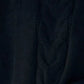 Dark textured cable-knit sweater with vertical stitching details