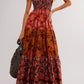 Floral tiered maxi dress in rust mustard tones with gold ribbon ties