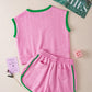 Pink cable-knit sleeveless top with green trim and matching shorts set
