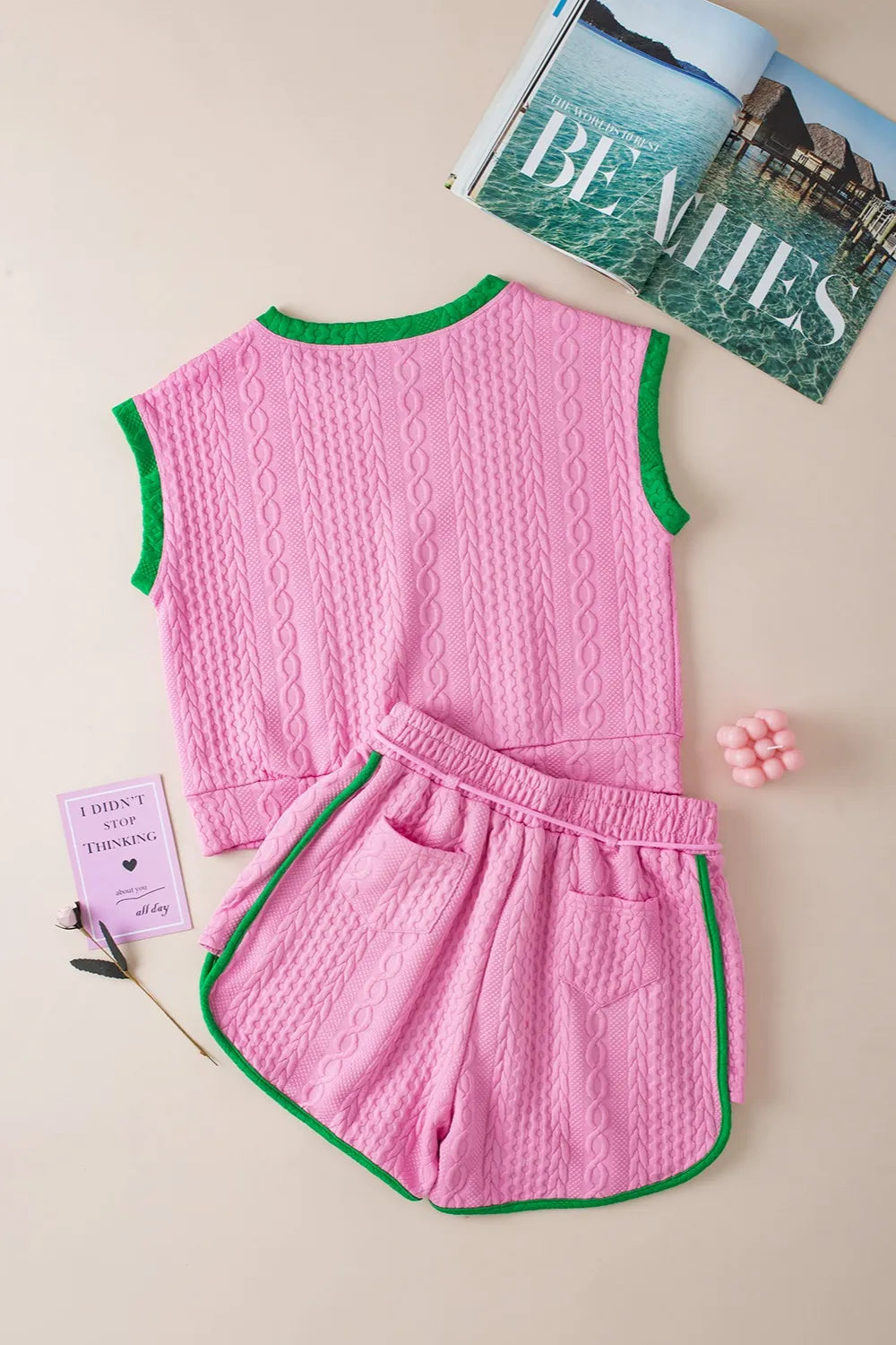 Pink cable-knit sleeveless top with green trim and matching shorts set
