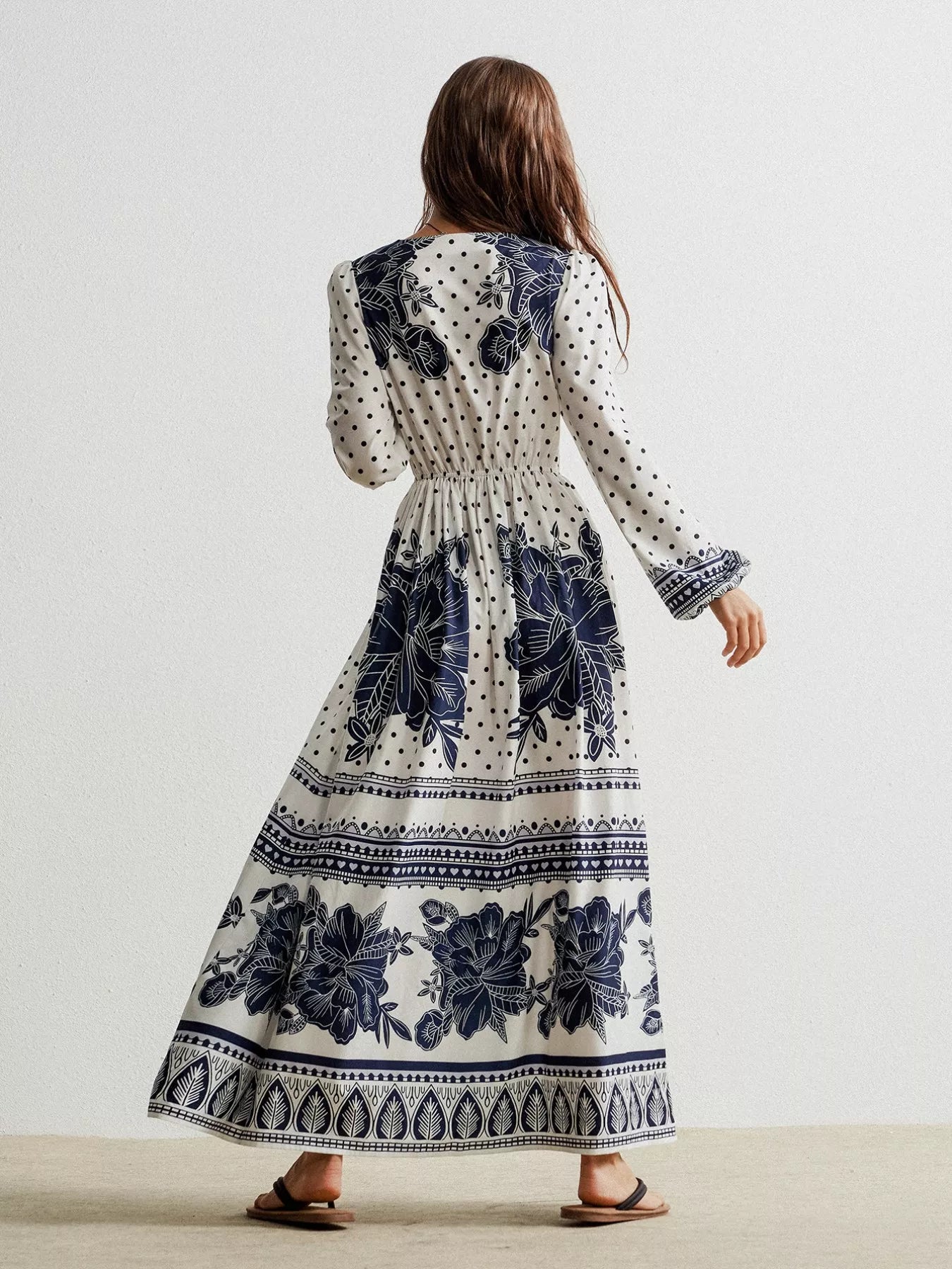 Floral print long sleeve maxi dress with navy blue patterns and gathered waist