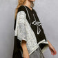 Black and white floral star patch hooded poncho with lace details