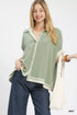 Mint-colored, lightweight blouse with contrasting white trim and button closure.