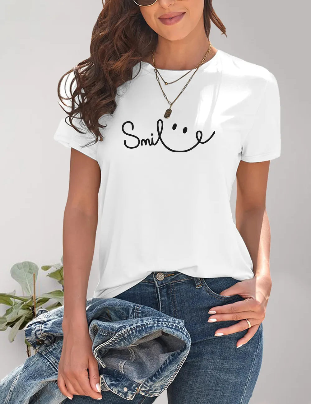 White Smiley Face T-Shirt with Layered Necklaces and Denim Jacket