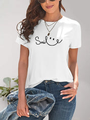 White Smiley Face T-Shirt with Layered Necklaces and Denim Jacket