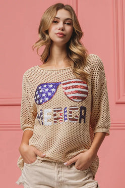 BiBi sequin American flag sunglasses knit cover up with beige sweater and Merica lettering