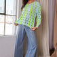 Vibrant lime green and light blue Davi & Dani knit top with black hearts