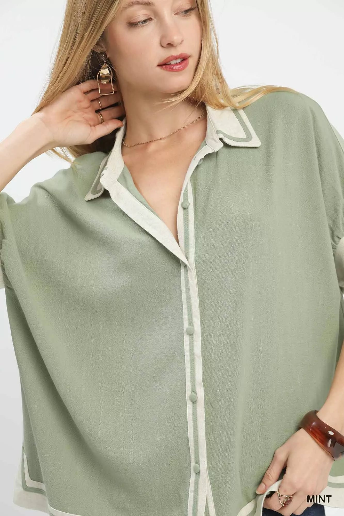 Mint Umgee linen blouse with cream collar, piping, and button front