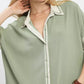 Mint Umgee linen blouse with cream collar, piping, and button front