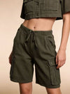 Olive green cargo shorts with drawstring waistband and multiple pockets