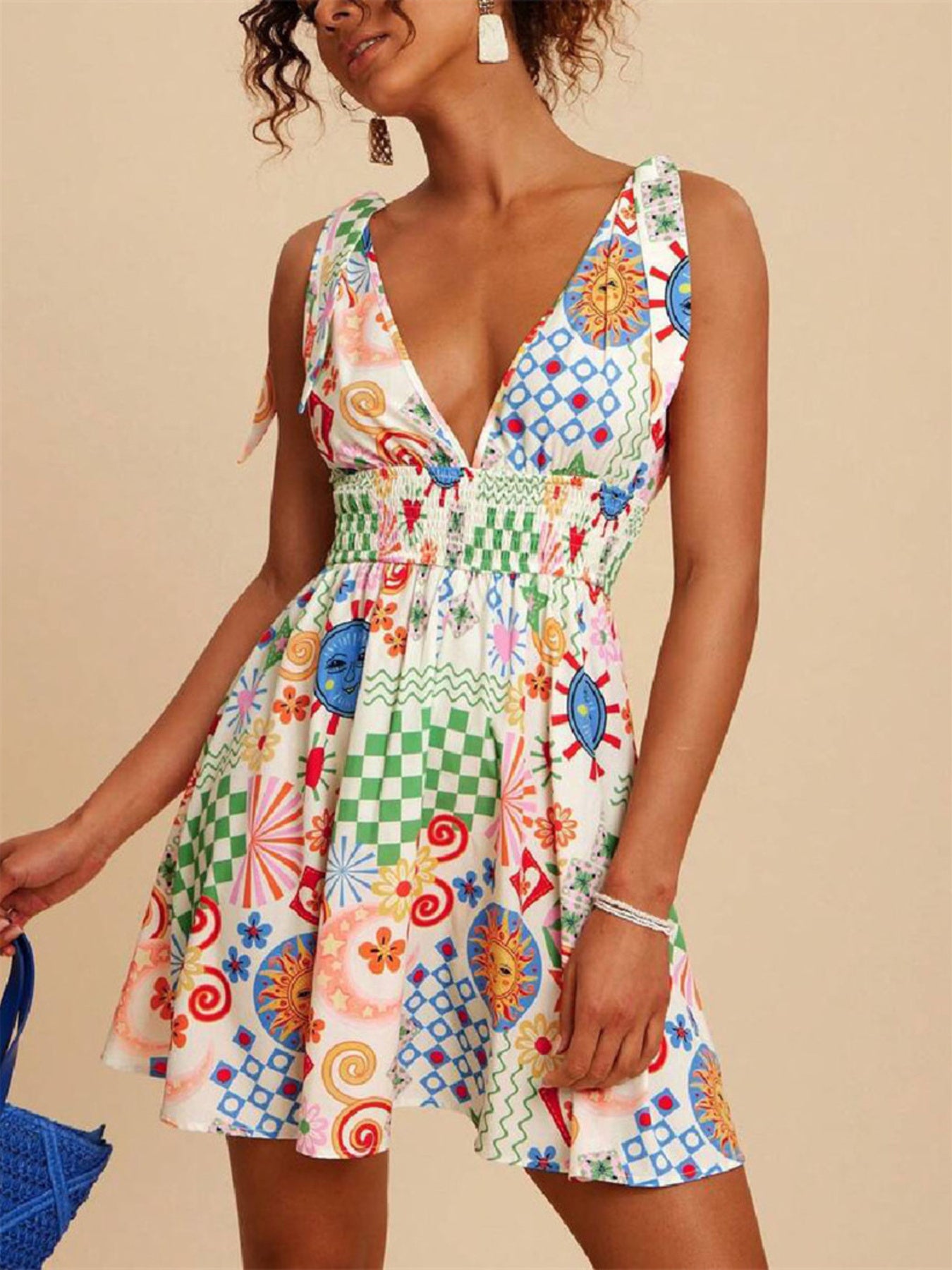 Daverri V-Neck Sleeveless Smocked Waist Printed Mini Dress with vibrant patchwork