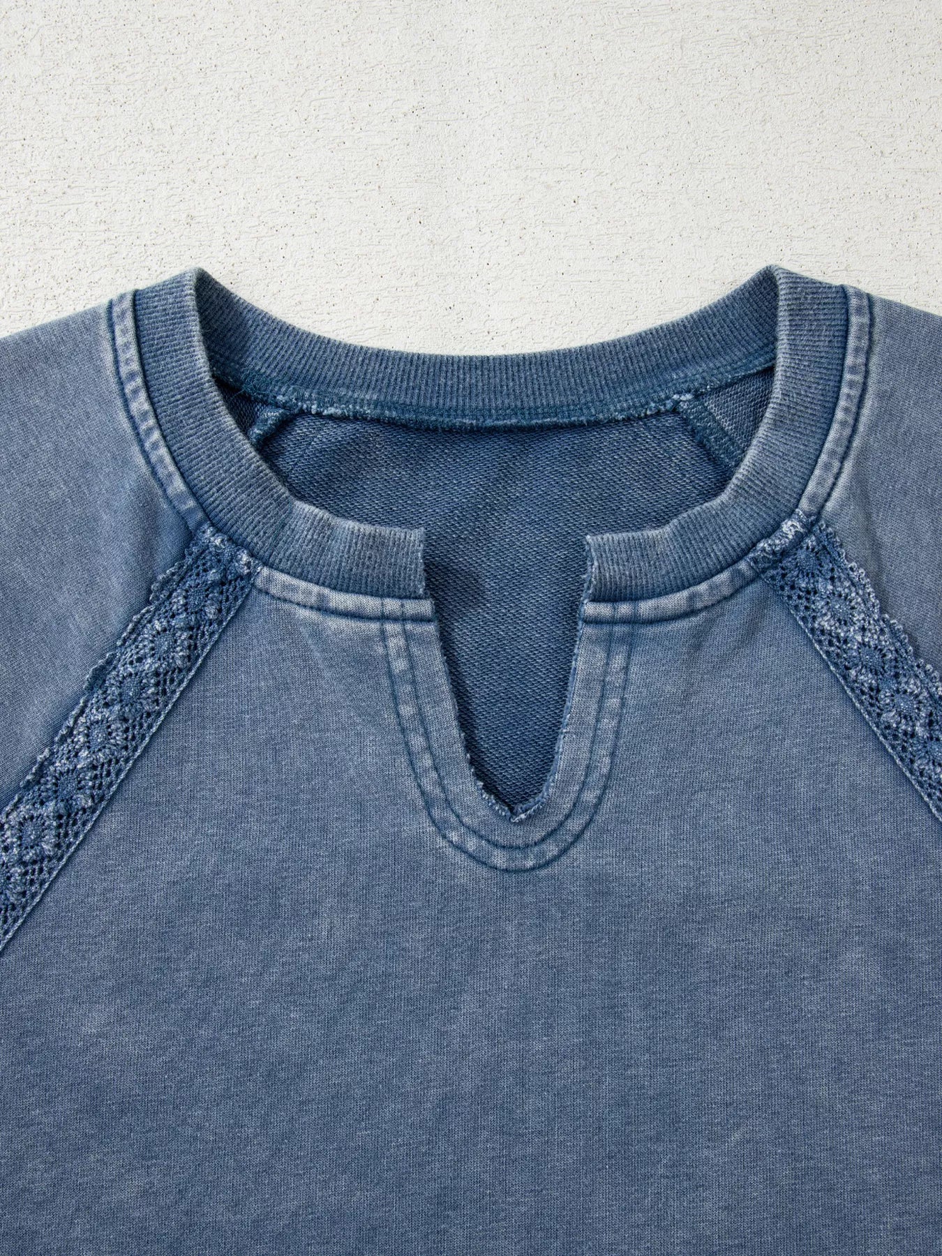 Blue mineral wash baggy sweatshirt with lace trim sleeves and keyhole neckline