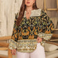 Plus size black floral print notched blouse with orange green patterns and lace collar cuffs