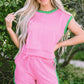 Pink textured knit two-piece set with green contrast trim