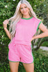Pink textured knit two-piece set with green contrast trim