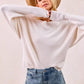 Cream-colored ribbed BiBi waffle knit off-shoulder sweater