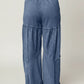Tiered wide-leg washed pants in blue denim with patchwork design