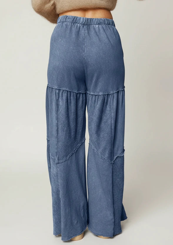 Tiered wide-leg washed pants in blue denim with patchwork design