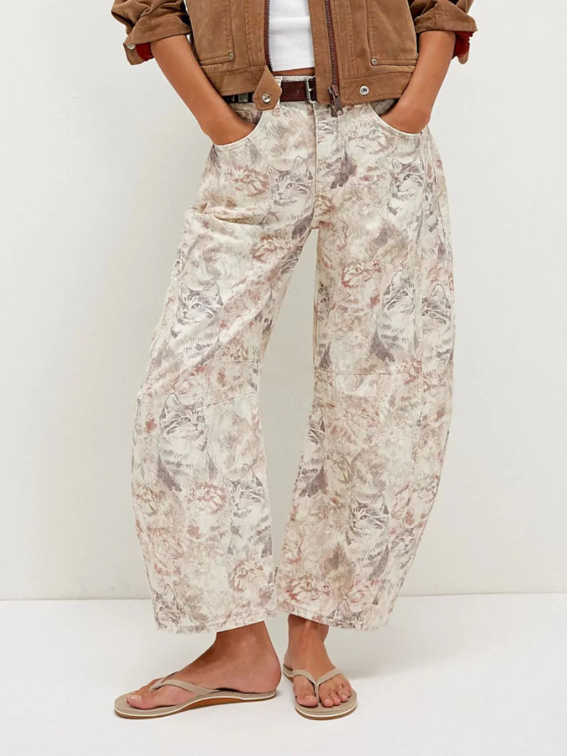 Printed wide-leg jeans with muted beige gray floral pattern