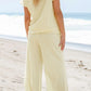 Daverri textured round neck top and pants set in pale yellow knit grid pattern