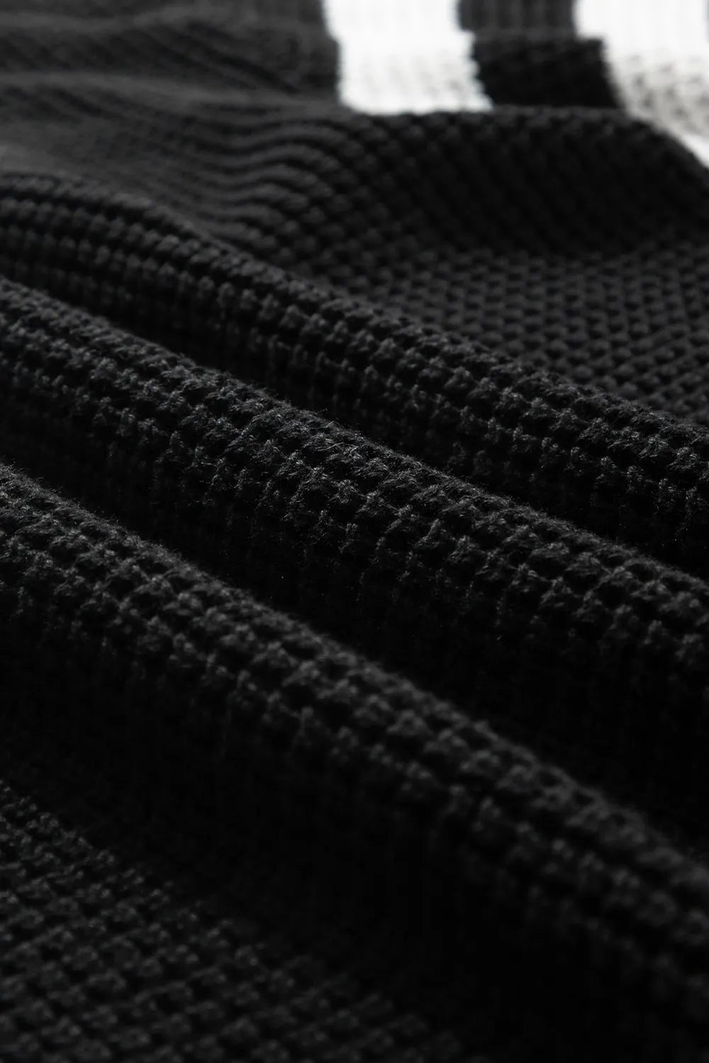 Black waffle-knit textured ribbed fabric for striped checkered turtleneck sweater