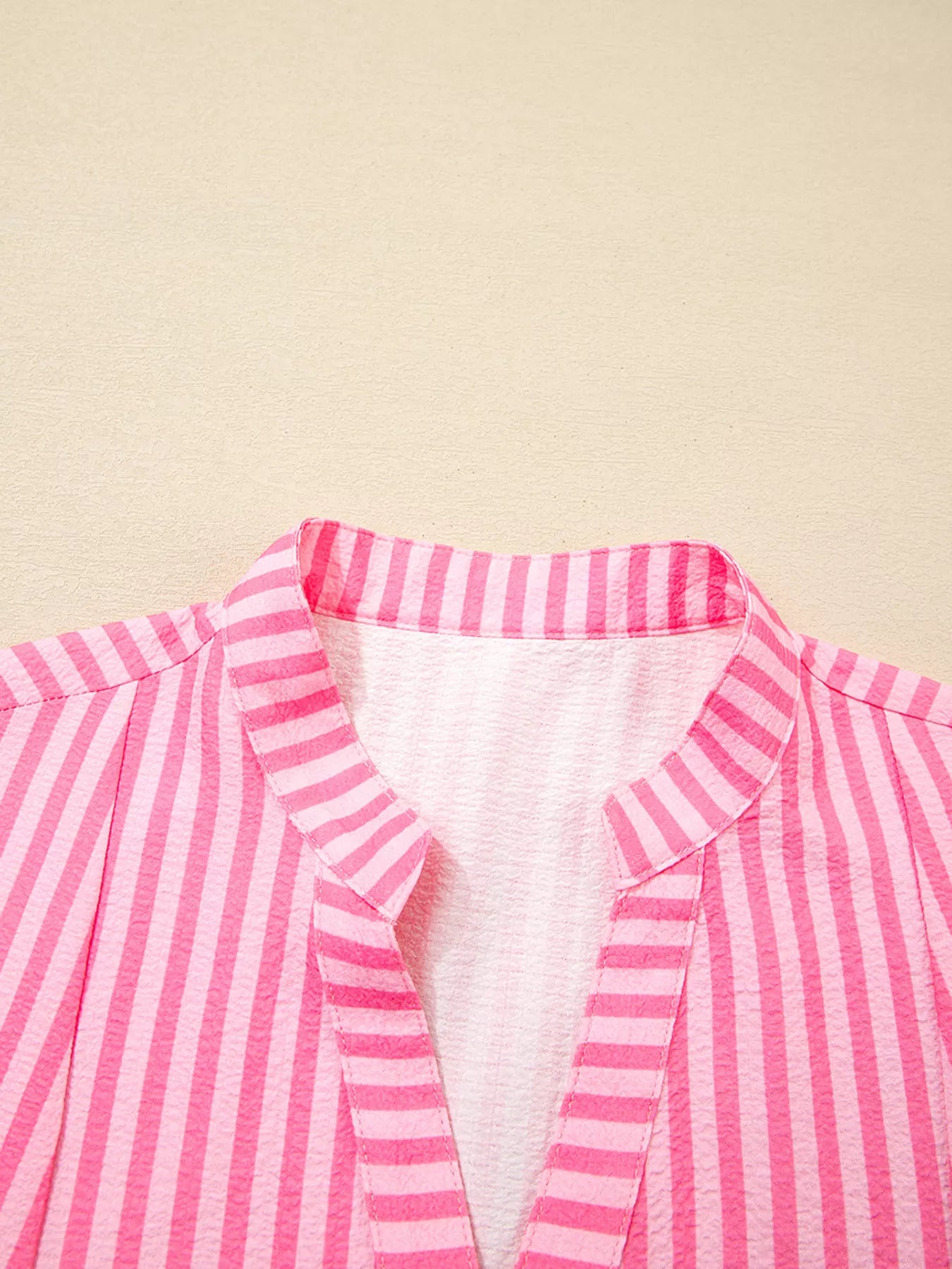 Pink and white striped blouse with collar in flowy mini dress