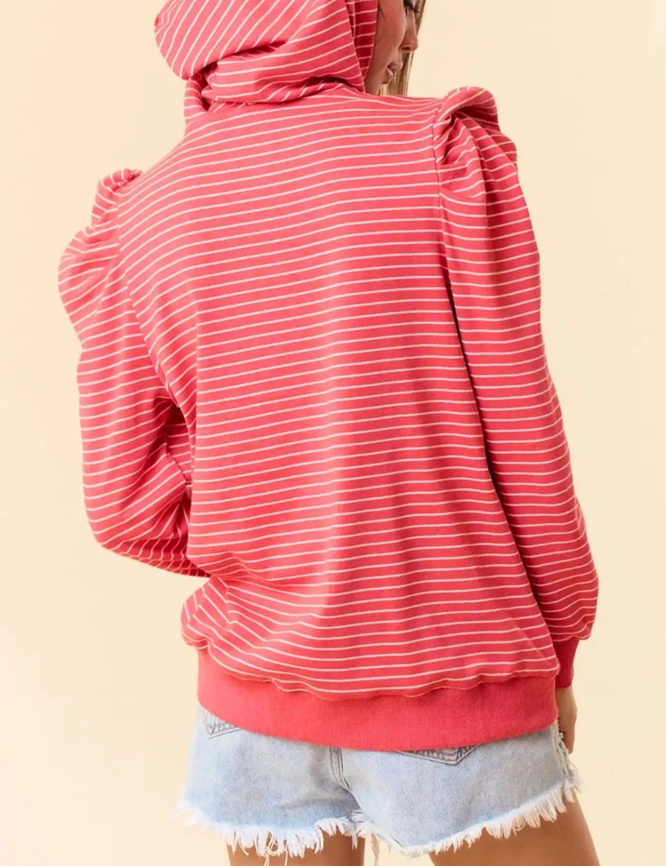 Coral striped hoodie with ruffled shoulders and drawstring hood